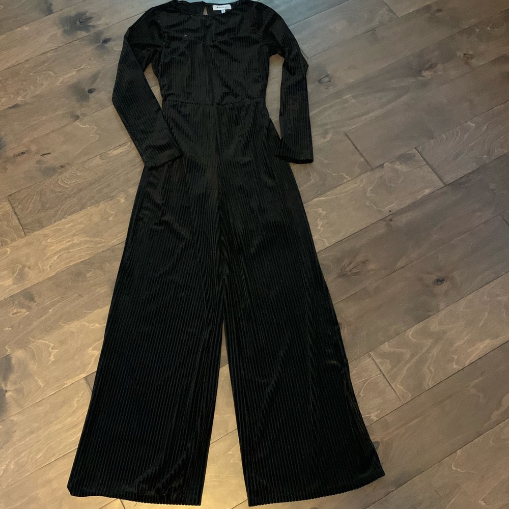 Black long sleeve ribbed jumpsuit with open back